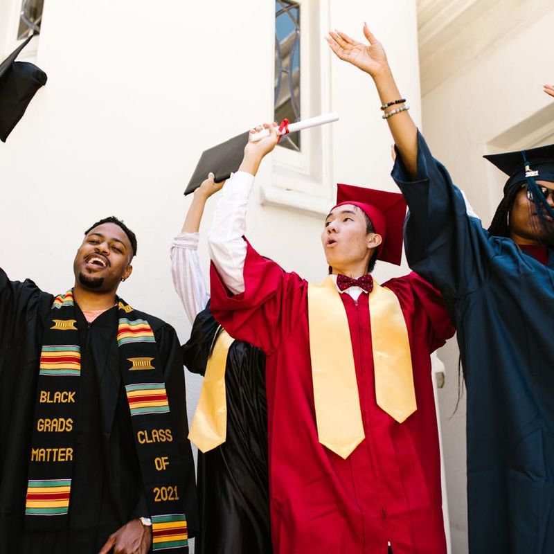 Graduates tossing their caps in celebration